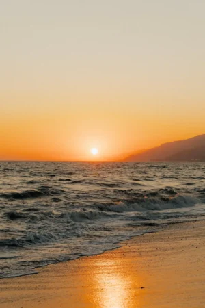 Golden Sunset Over a Rocky Shoreline Photographic Poster 102