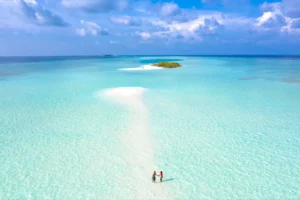 Two People Walking on a Shallow Sandbar Photographic Print 125
